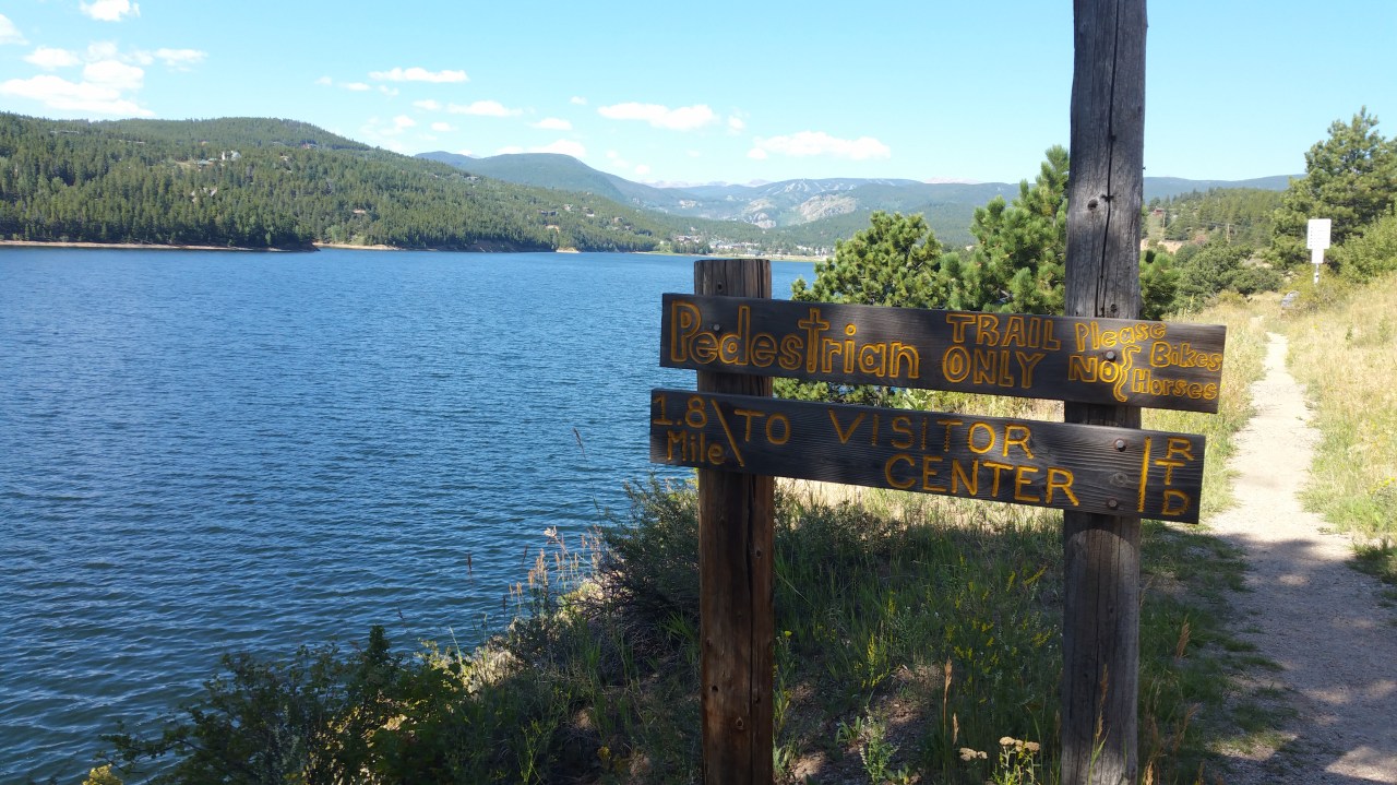 Pedestrian Trail sign and view of Barker Reservoir in Nederland, Colorado